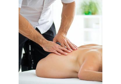 Therapist providing back pain relief session
